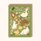 A greeting card with a green background featuring illustrations of various ducks and flowers, with the text 'Quacky Birthday' at the top.