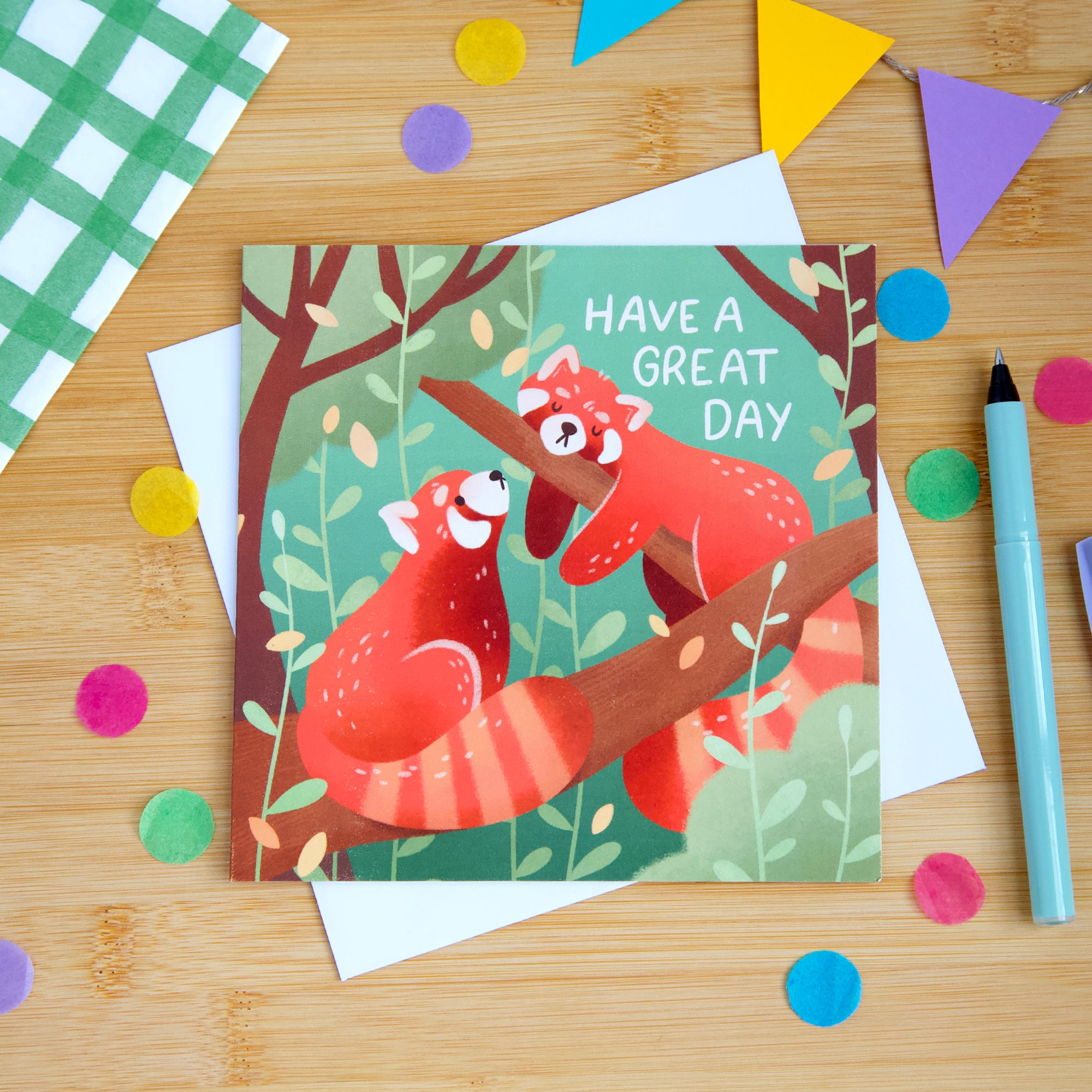 A photograph of a red panda birthday card