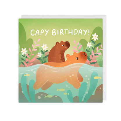 A birthday card featuring two illustrated capybaras swimming, that reads "capy birthday".