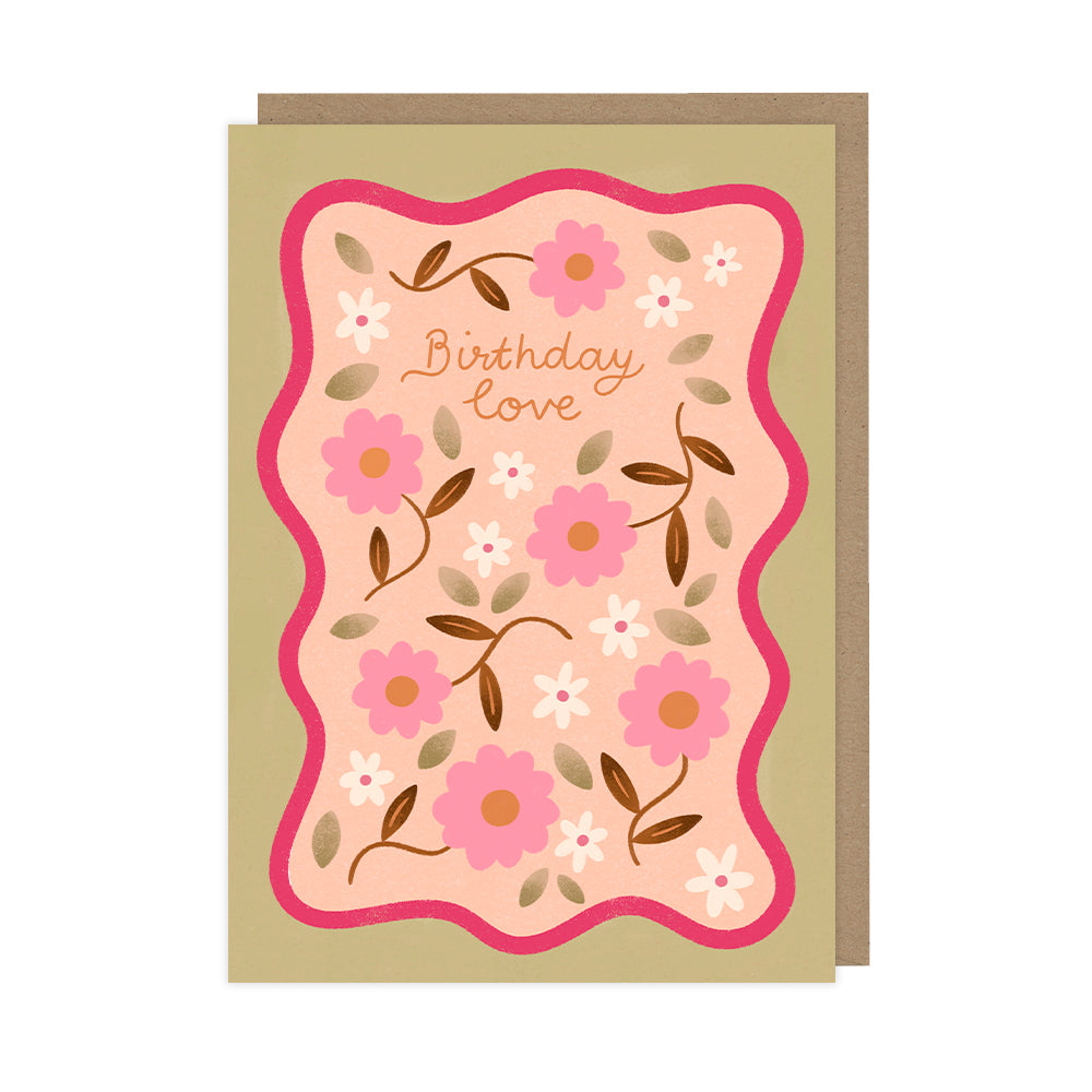 An illustrated floral birthday card featuring pink flowers with a kraft envelope. 