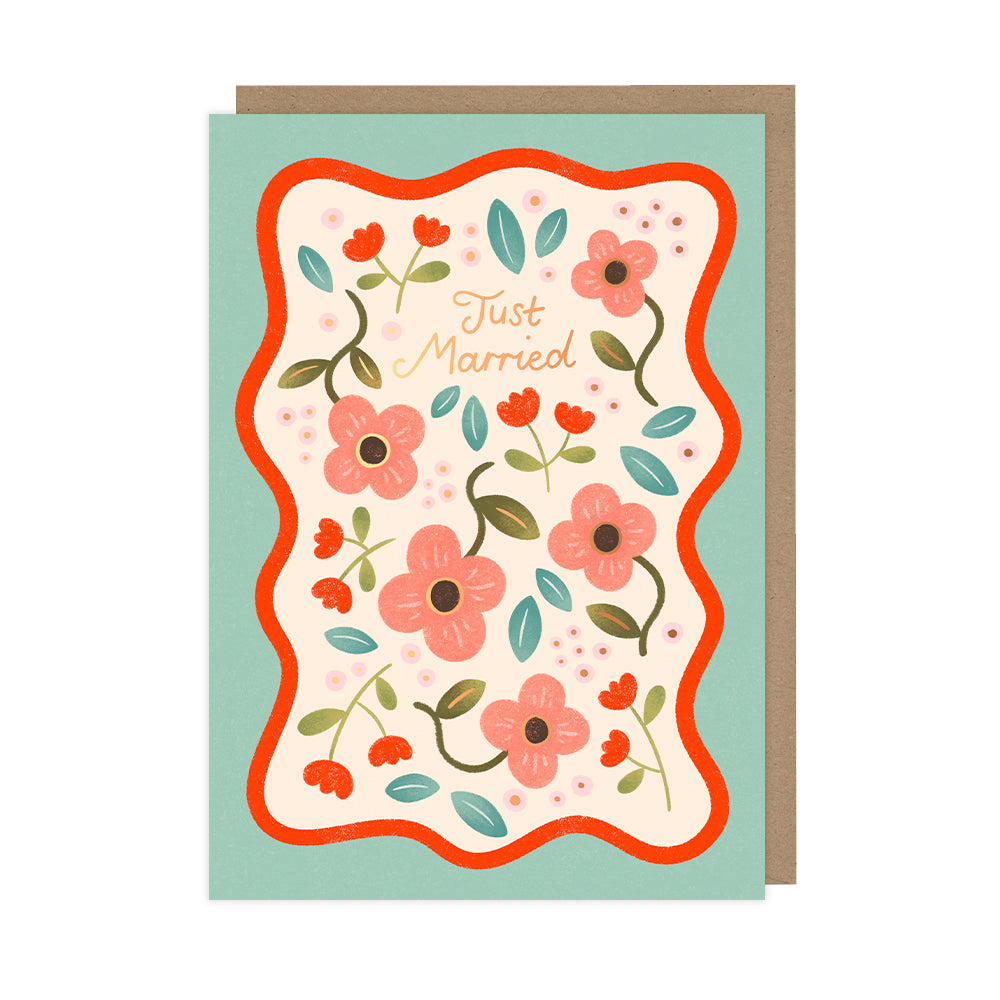 A wedding card that features pink and red flowers and reads "Just married". 