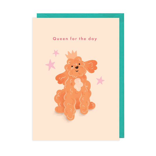 A birthday card featuring a fluffy dog wearing a crown that reads "queen for the day". 